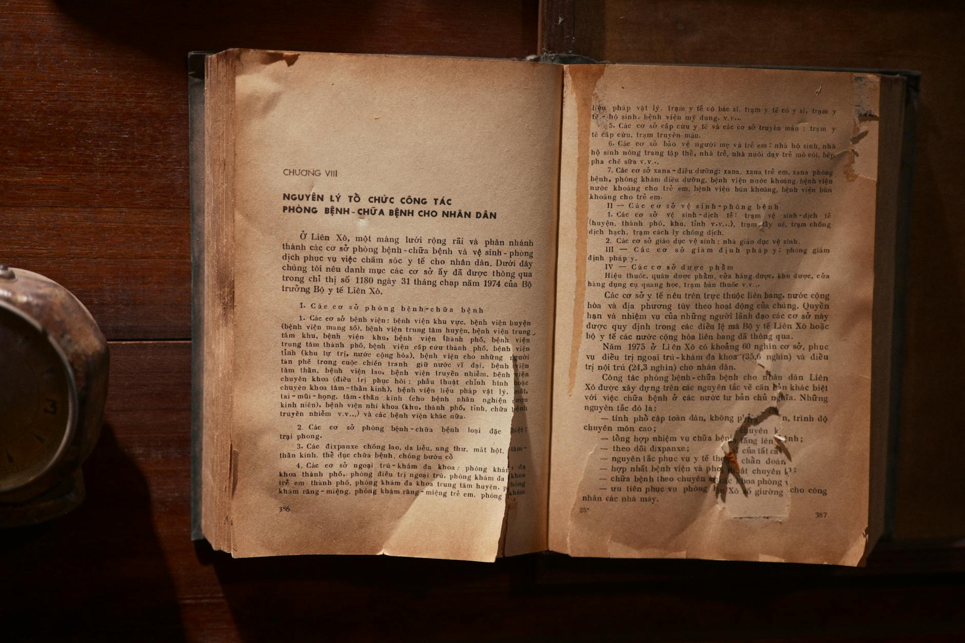 Open book beside film equipment representing literary adaptations