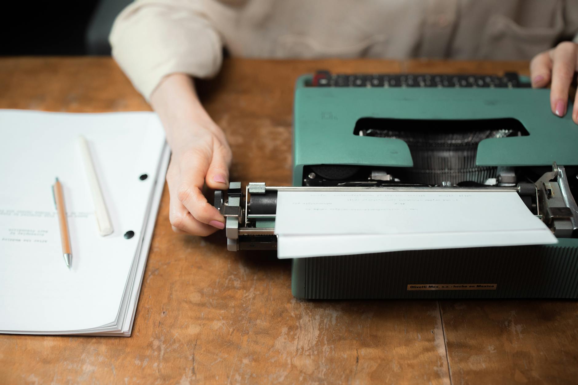 Close-up of vintage typewriter with paper showing typed text