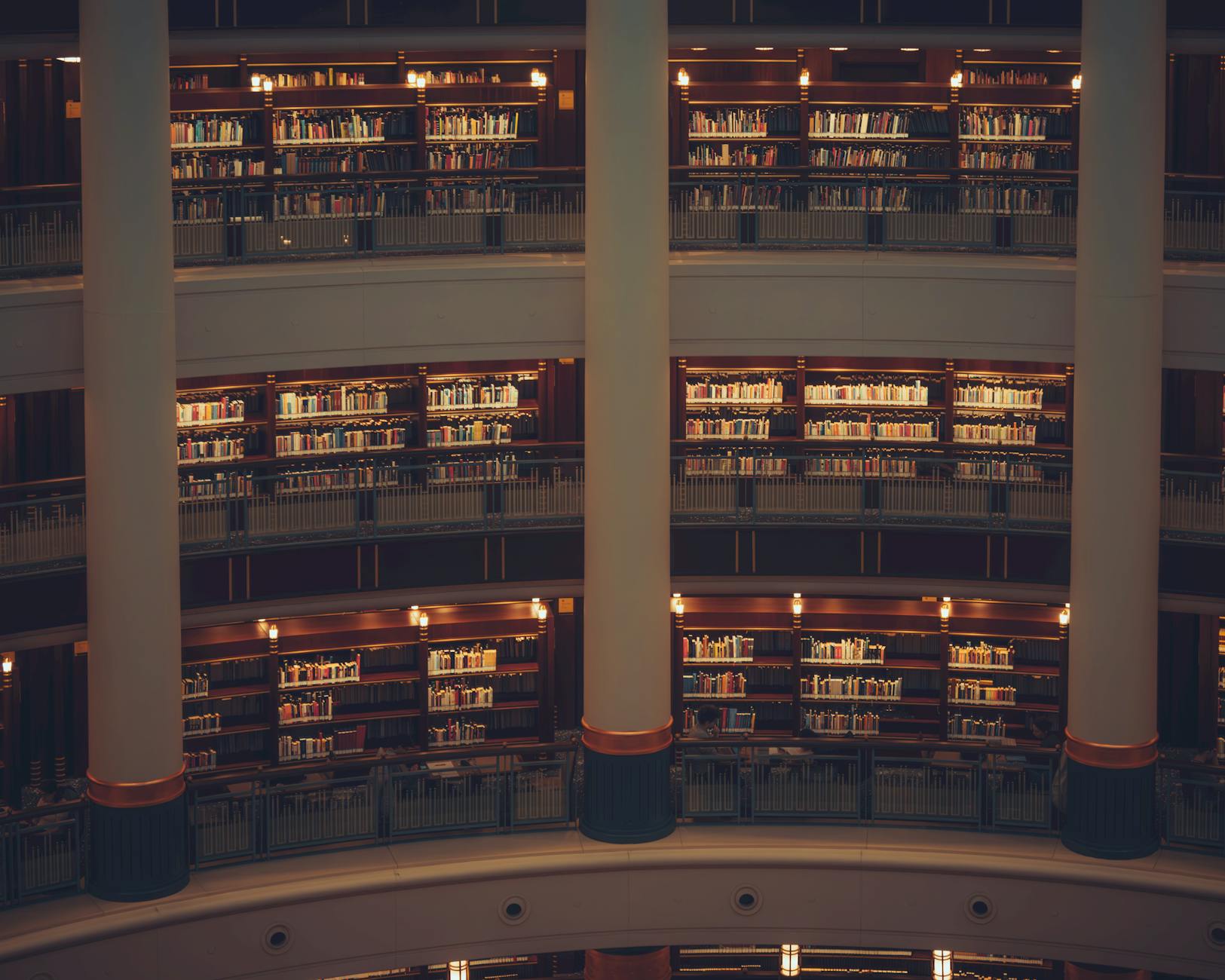 Long corridor of bookshelves inside a university library