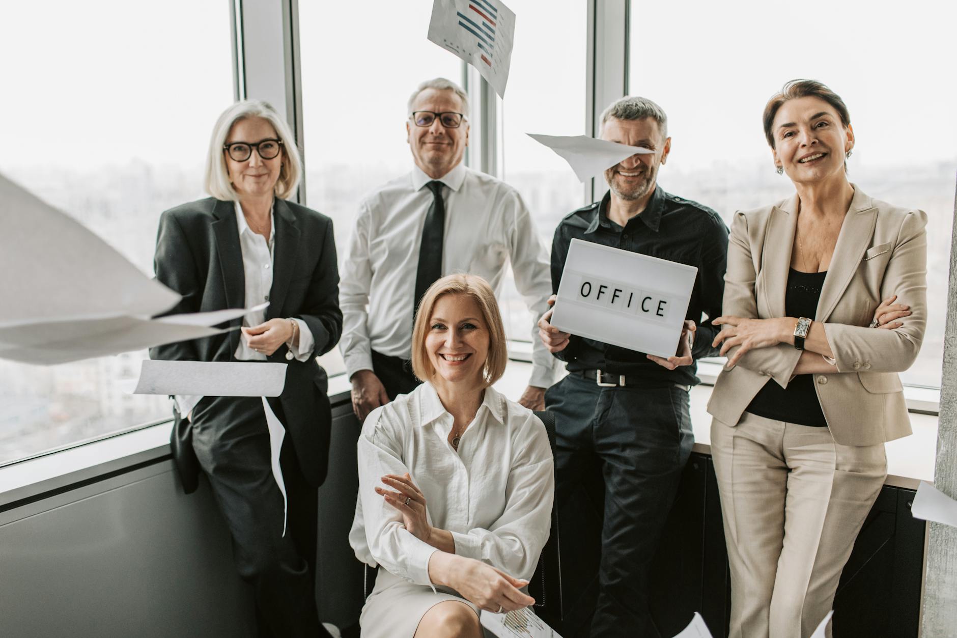 Small team gathered around a table in a creative office workspace