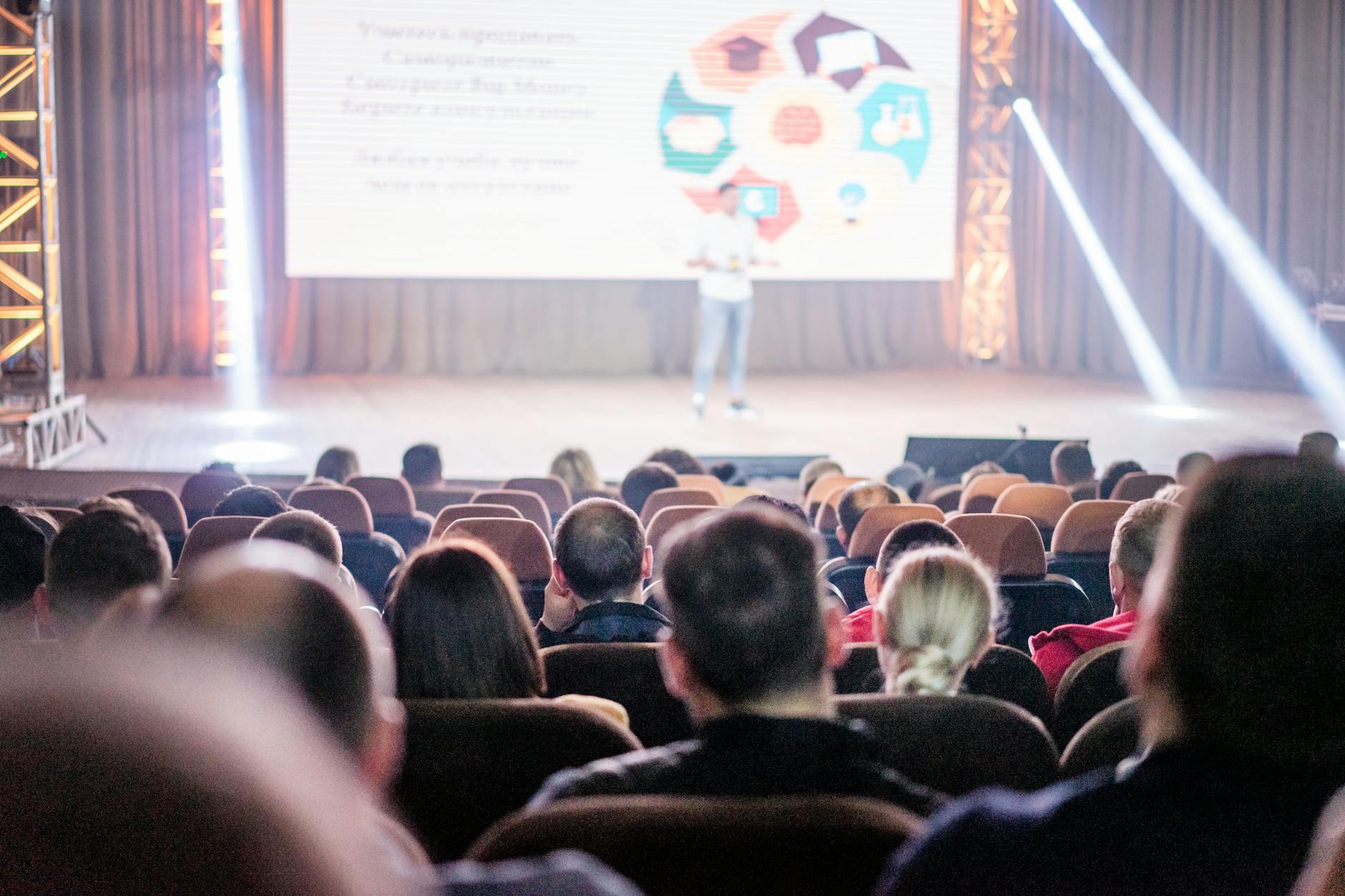 Speaker presenting research findings at an academic conference