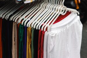 Vibrant street fashion stall with colorful clothing on display