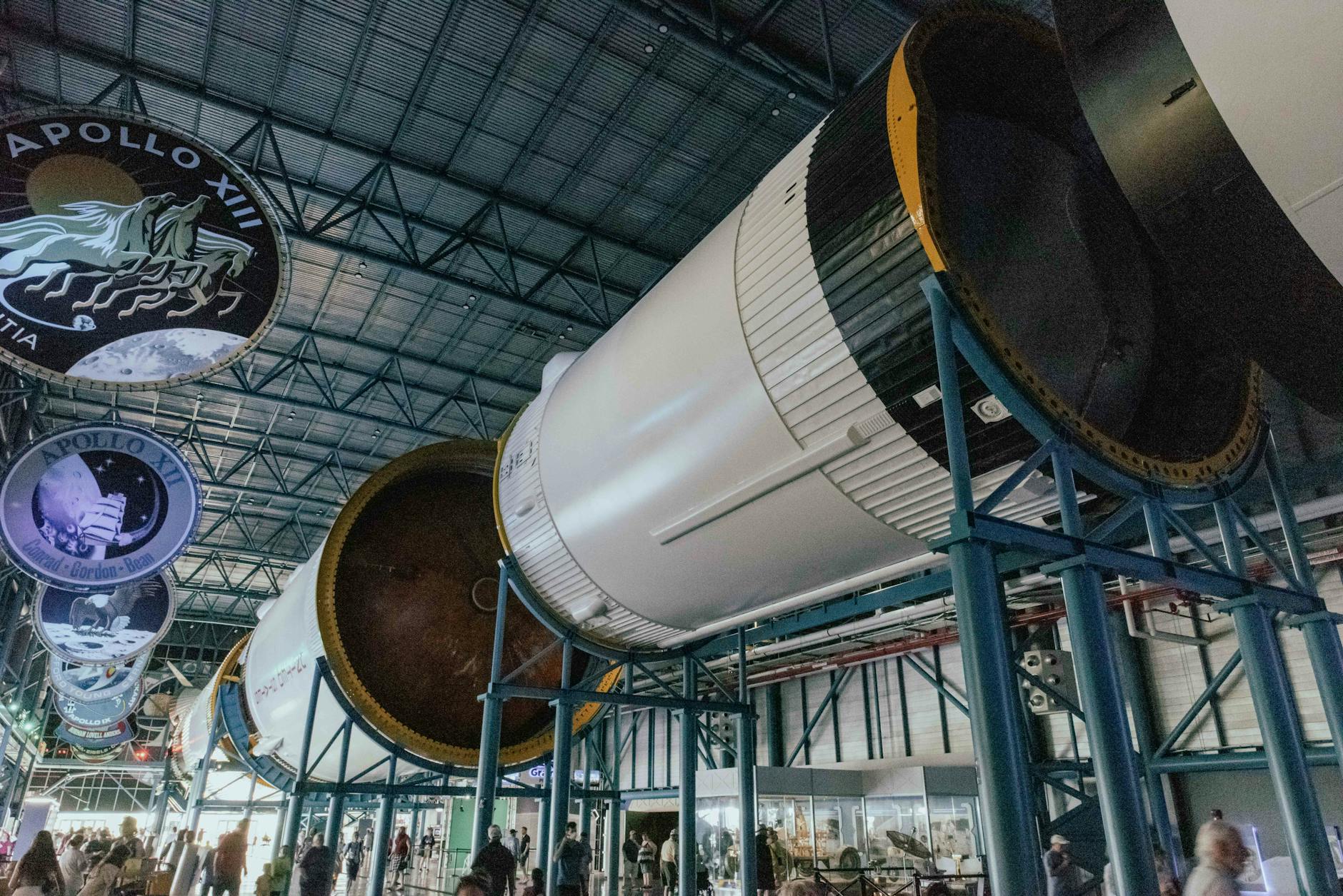 A retired spacecraft on display inside a museum, representing the shuttle program's legacy