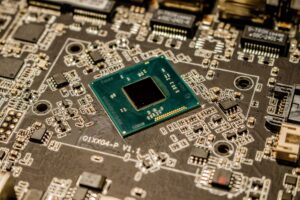 Microsoft Left a Secure Boot Door Open for 13 Years Close-up of a computer motherboard showing UEFI firmware chip components