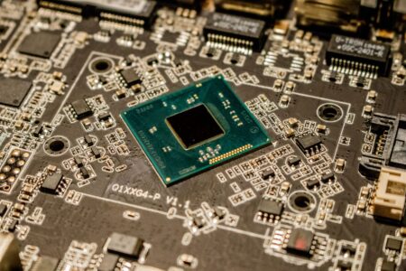 Microsoft Left a Secure Boot Door Open for 13 Years Close-up of a computer motherboard showing UEFI firmware chip components
