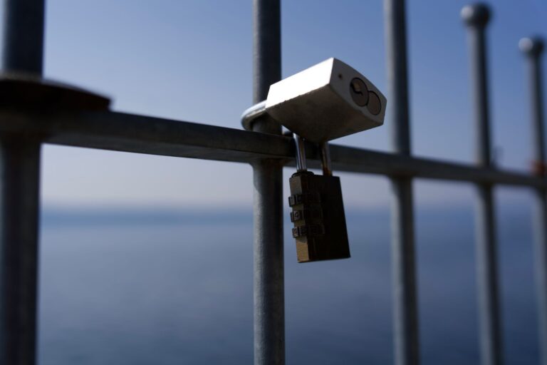 A laptop with a security padlock icon on the screen representing malware threats