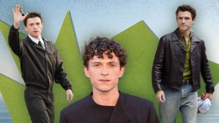 Tom Holland Brings Bold Style to His Odyssey Press Tour Male actor posing on a red carpet in sharp tailored suit