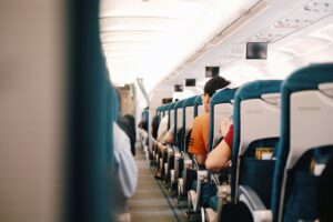 Passengers seated inside a commercial airplane cabin