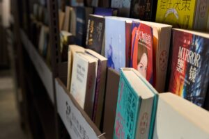 Rows of books on library shelves representing the literary week in review