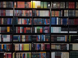 Stack of science fiction and fantasy novels on a wooden table
