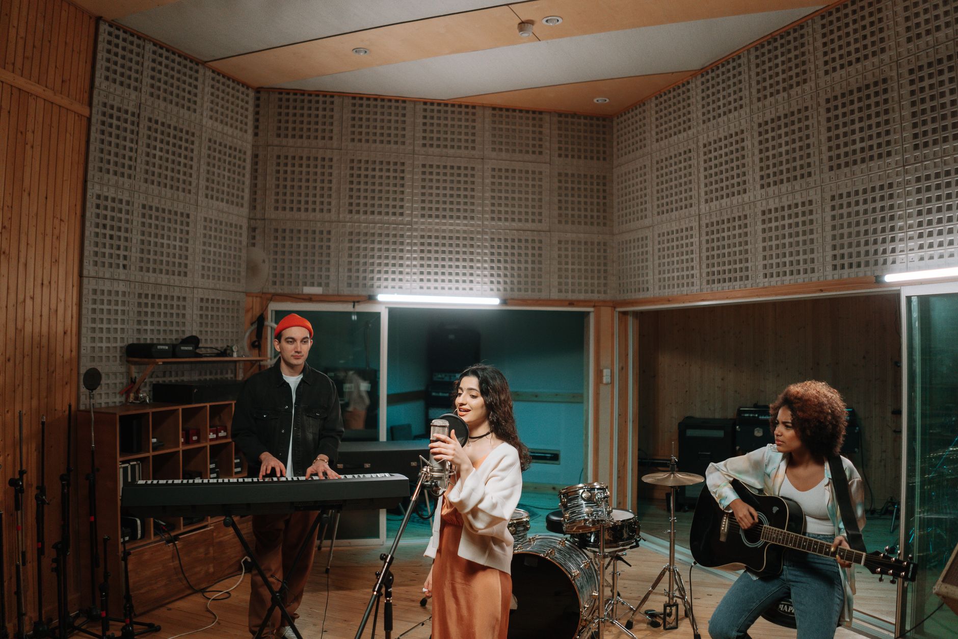 Artist recording music in a modern studio with ambient lighting