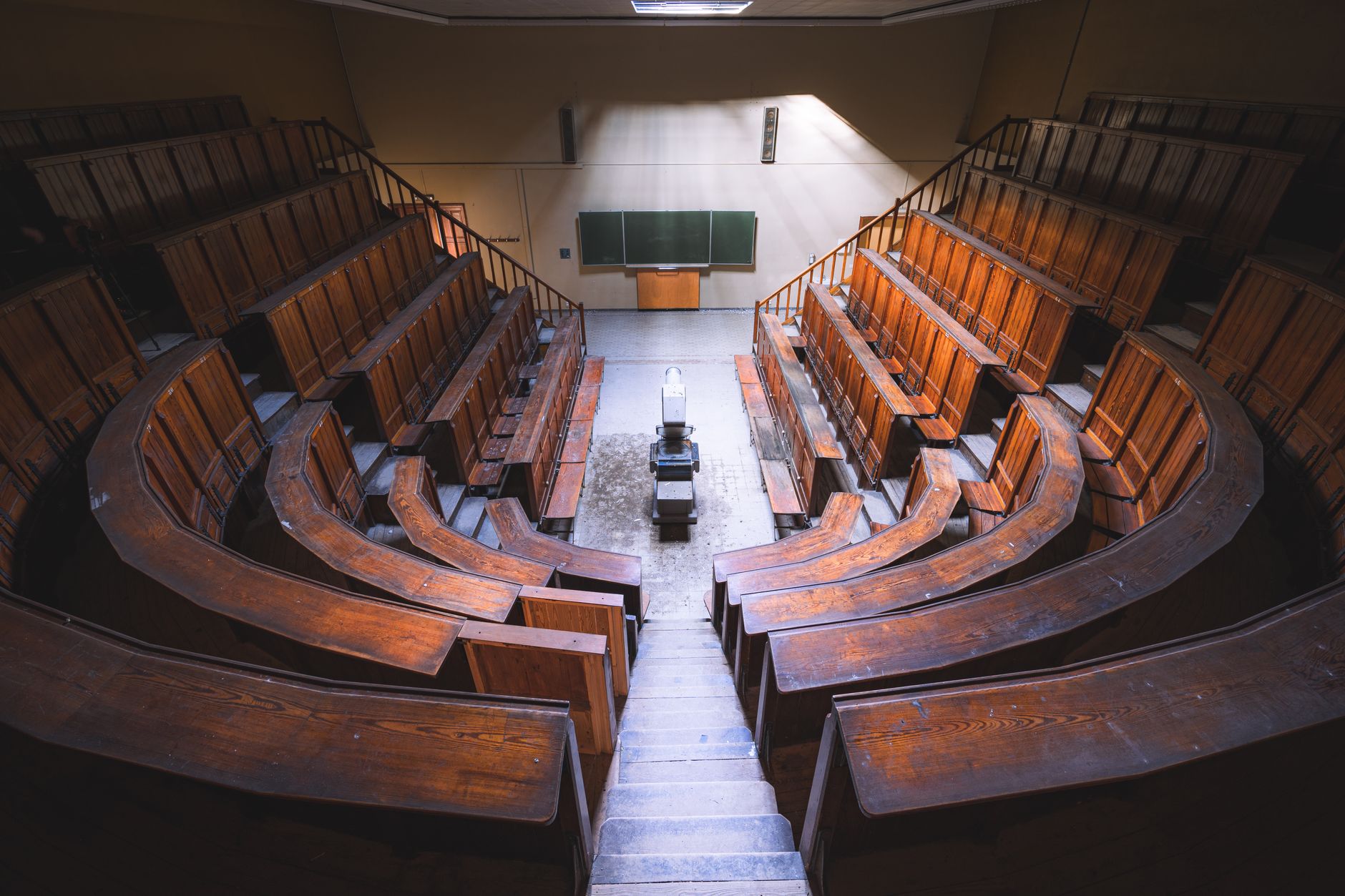 Empty university lecture hall evoking debates around academic labor and Black scholars