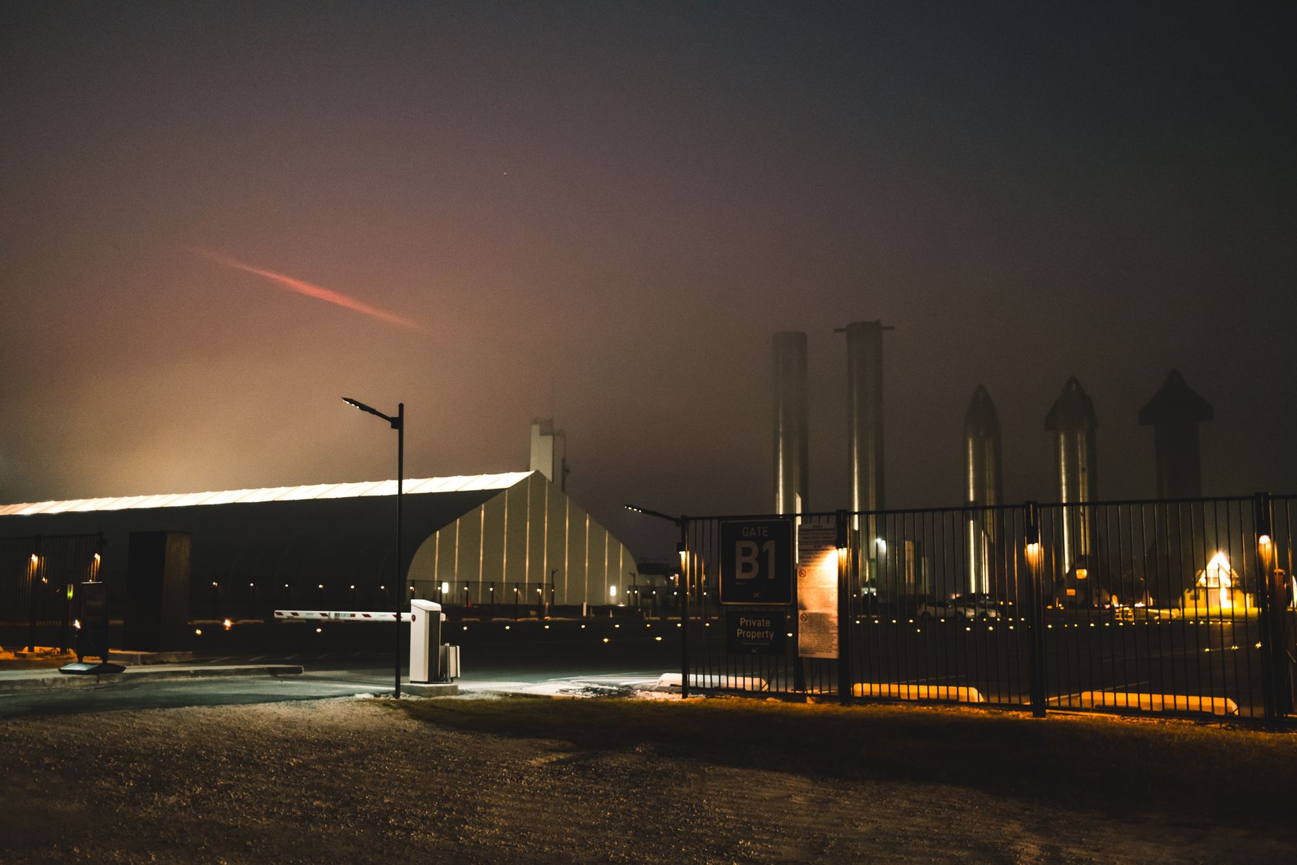 A large rocket standing on a coastal launch pad before liftoff