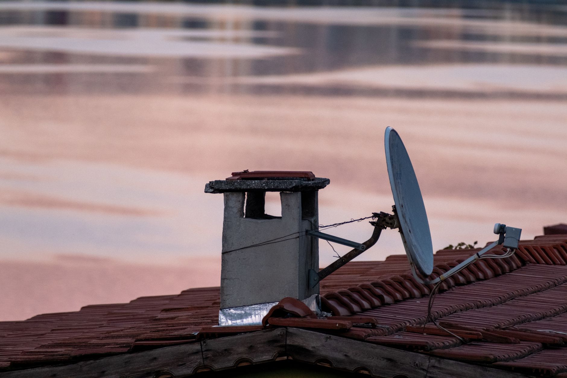Large satellite dish against a clear sky representing Earth observation technology