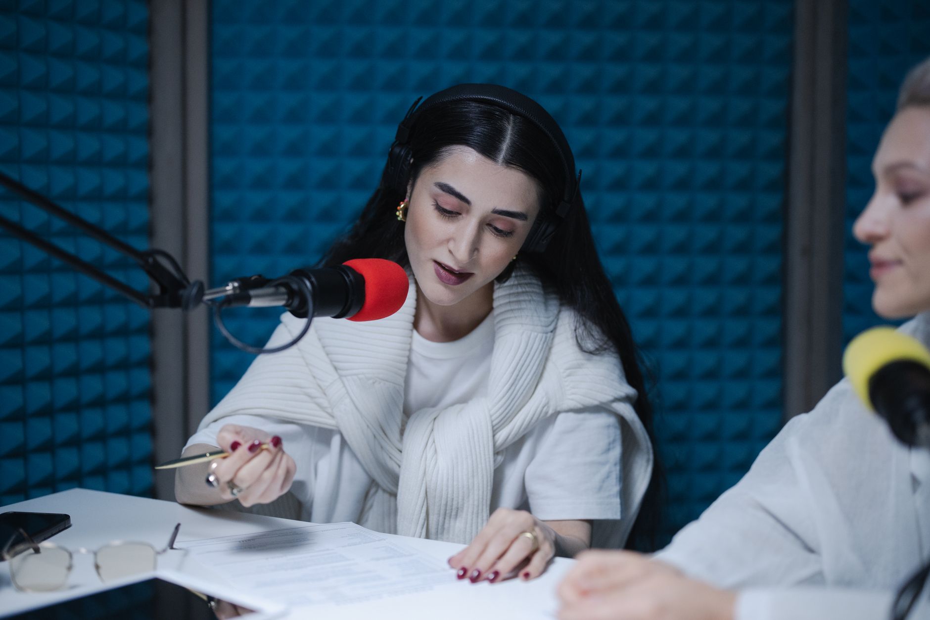 A broadcast microphone in a radio studio setting
