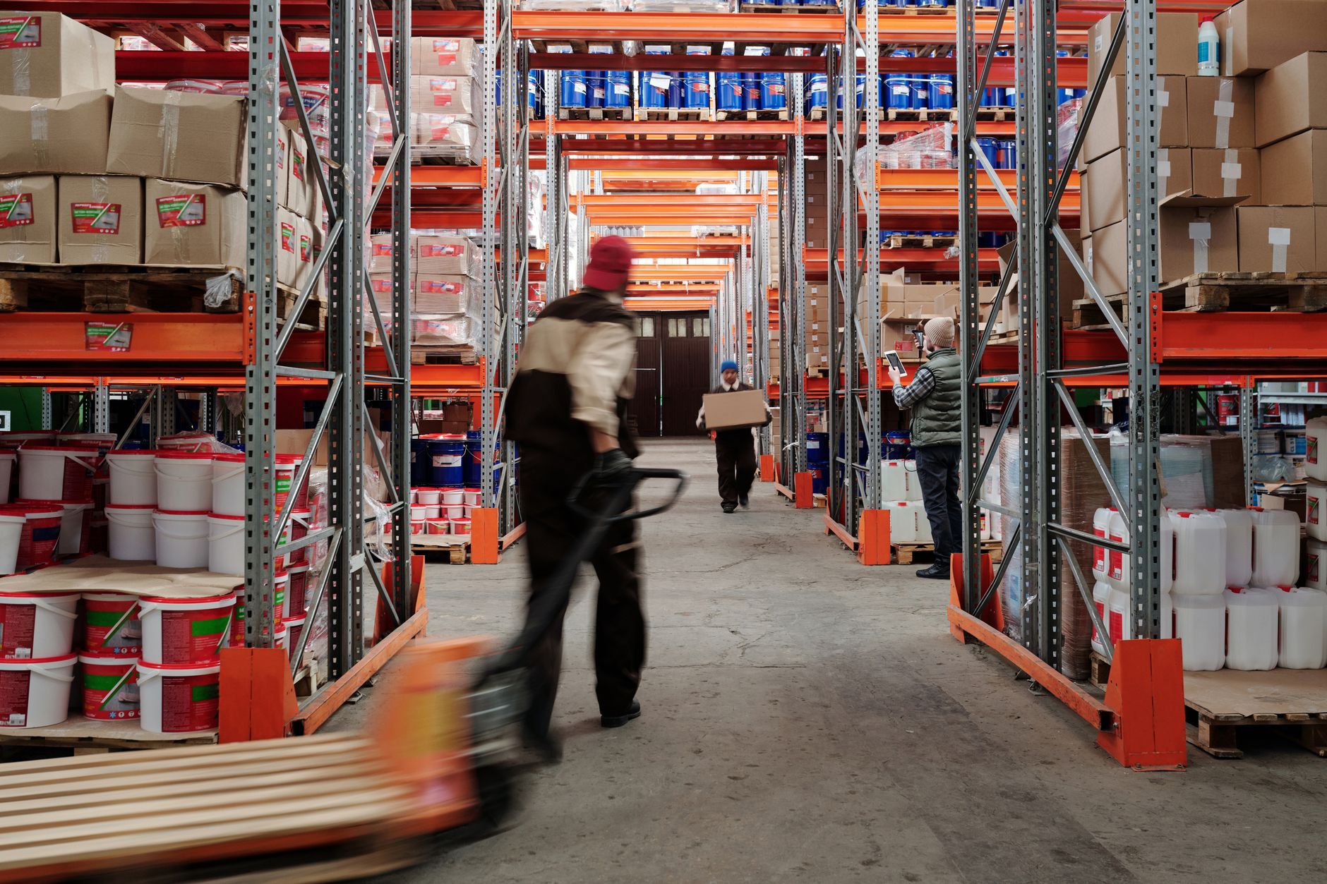 Long rows of shelving inside a large distribution warehouse
