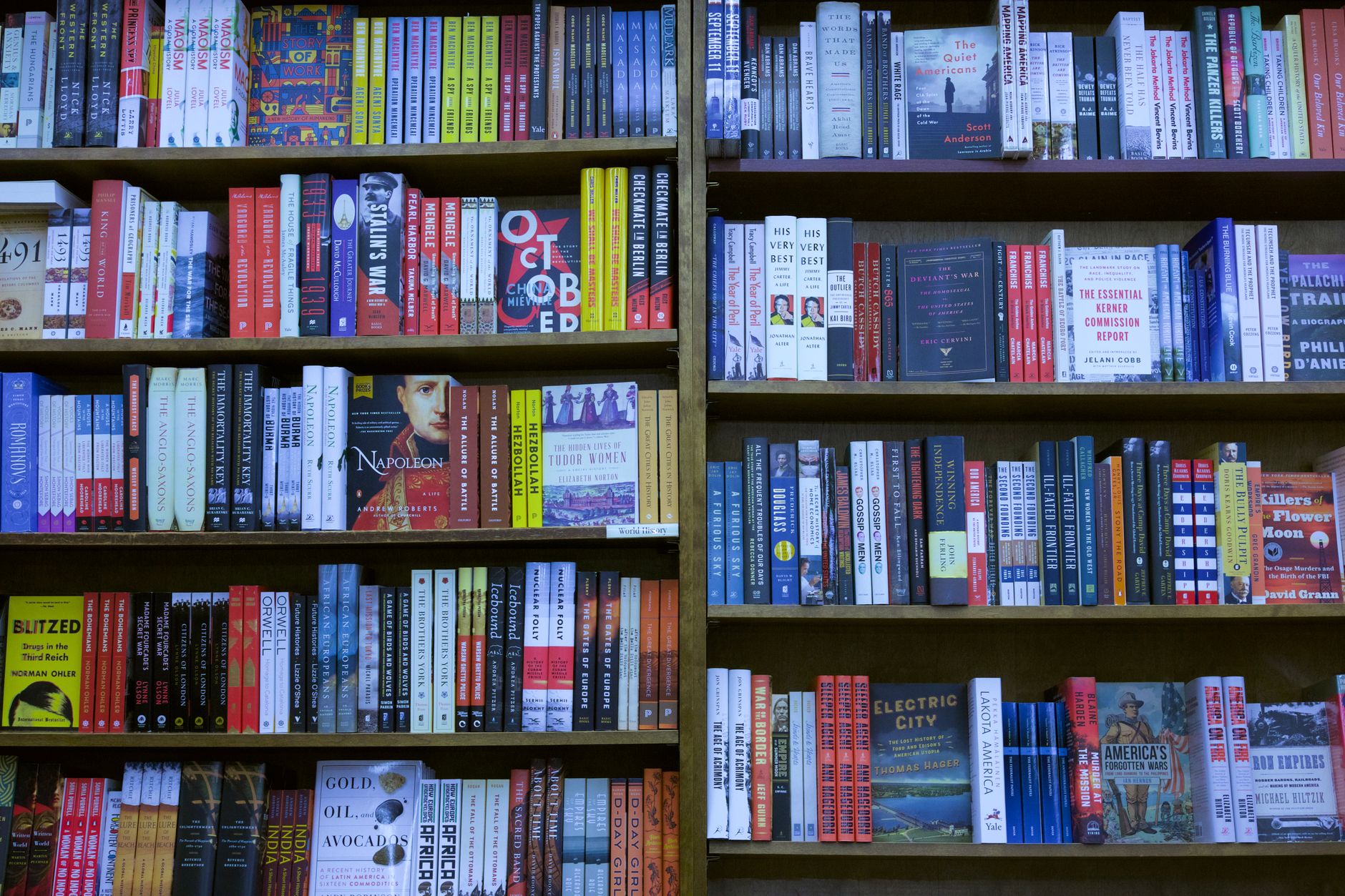 Fiction paperbacks lined up on a bookstore shelf