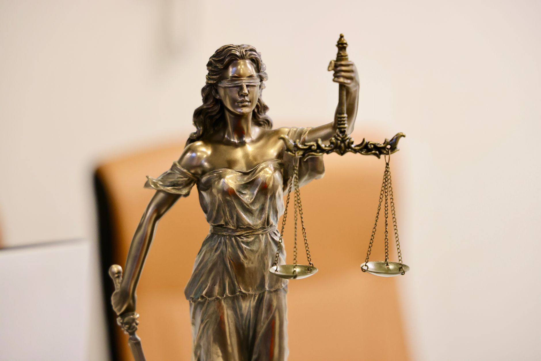 A courtroom interior with legal scales, representing dual legal structures and contested justice