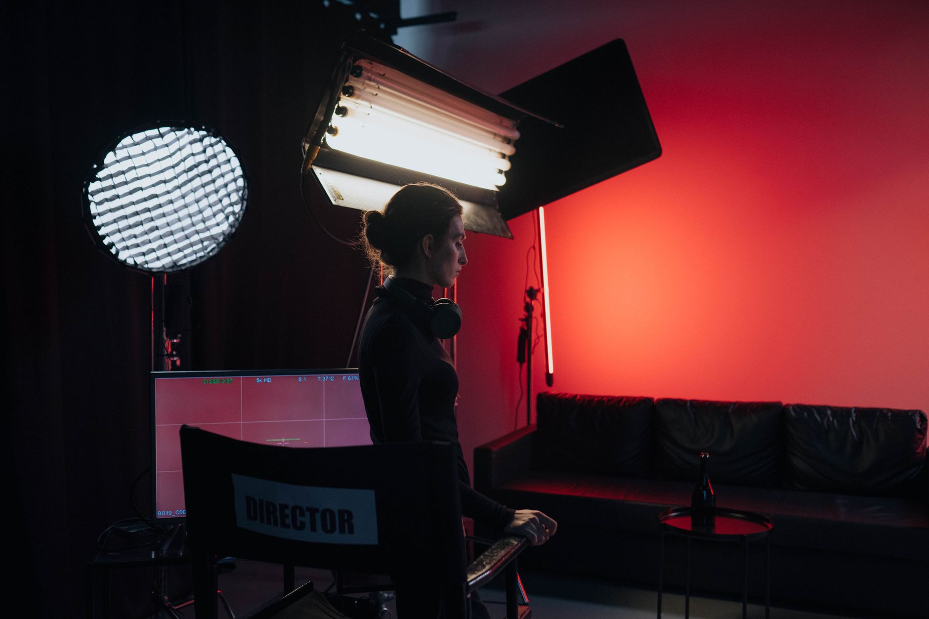 Behind-the-scenes view of a film production crew on location at a period-accurate set