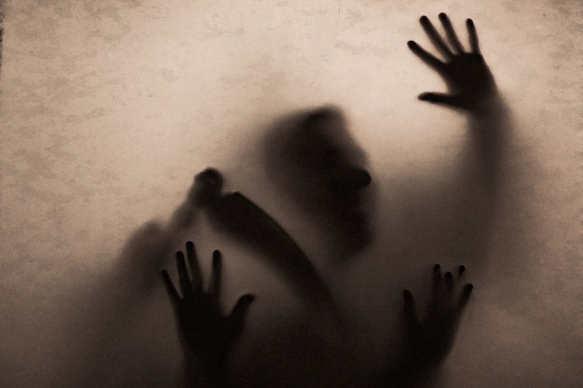 Dramatic shadowy corridor evoking horror film atmosphere