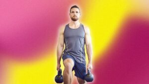 Man lifting weights alone in a gym during a training session