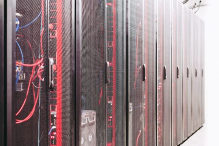 Apple reportedly building server packed with M-series Ultra chips for AI Rows of server hardware in a modern data center rack