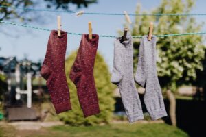 A display of various styles of socks arranged by color and length