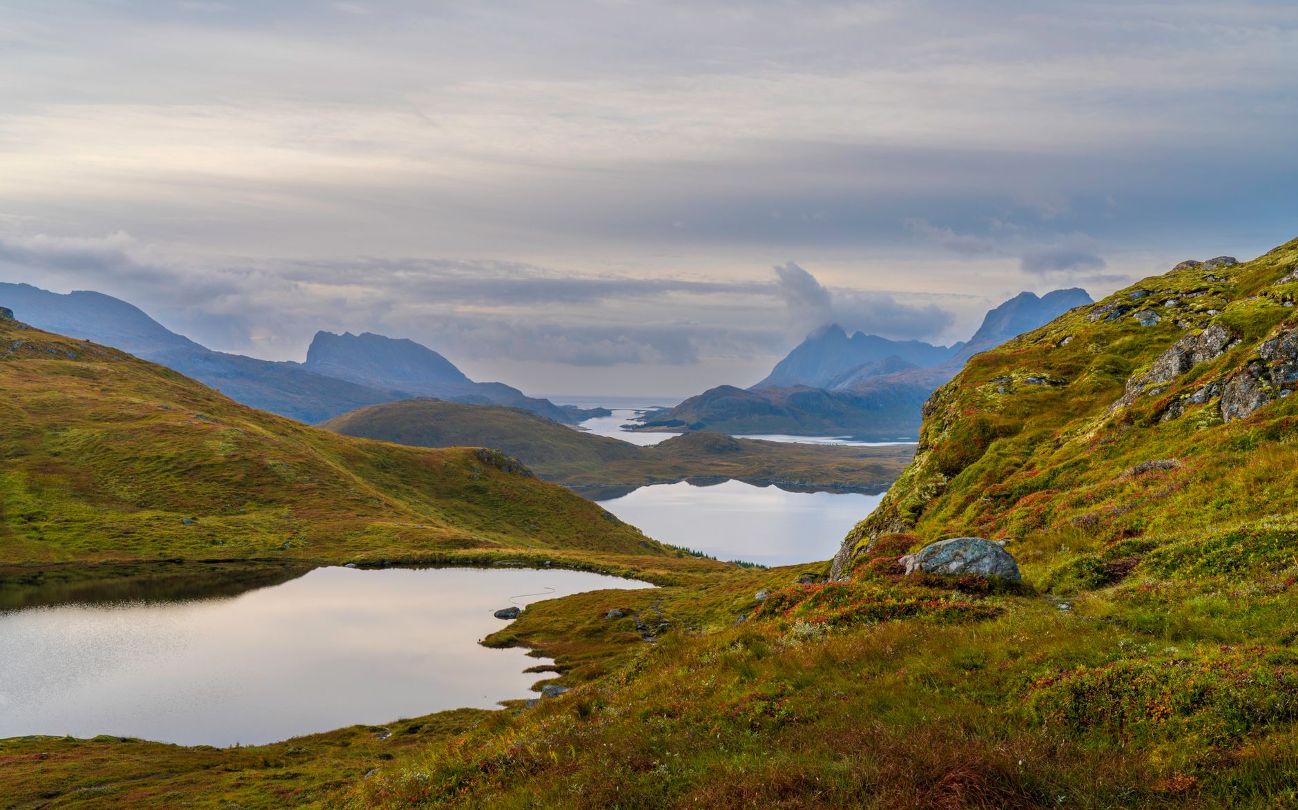 Remote Arctic Norwegian coastline under a pale evening sky