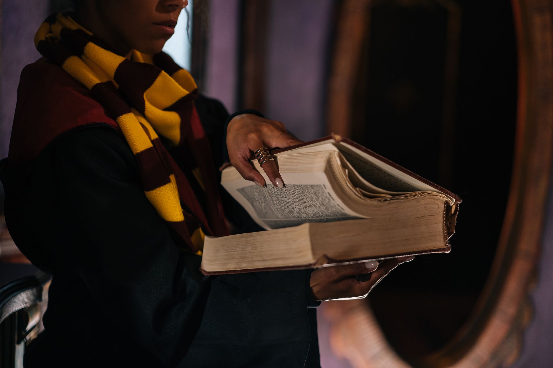 An aged open book with handwritten pages suggesting a spellbook or grimoire