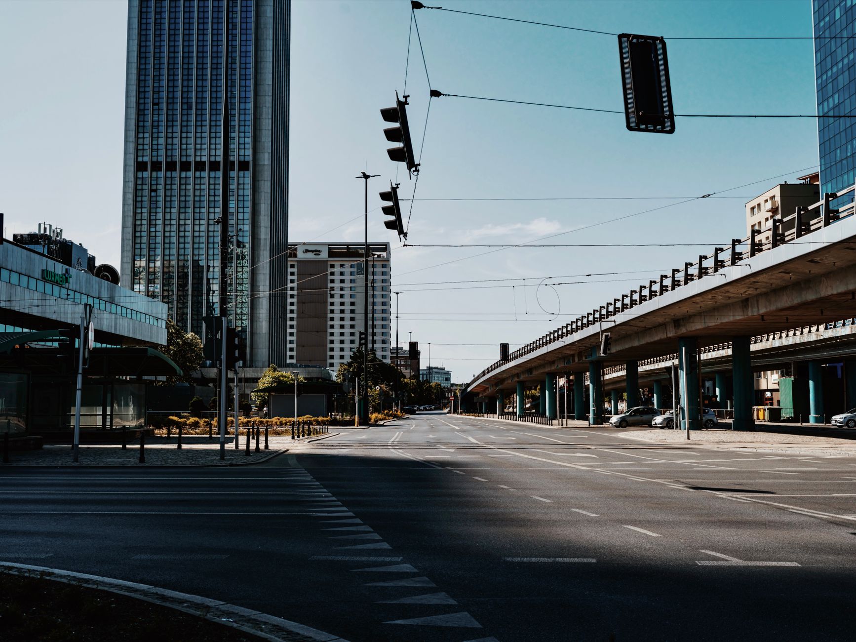An empty urban street with nobody walking on the pavement