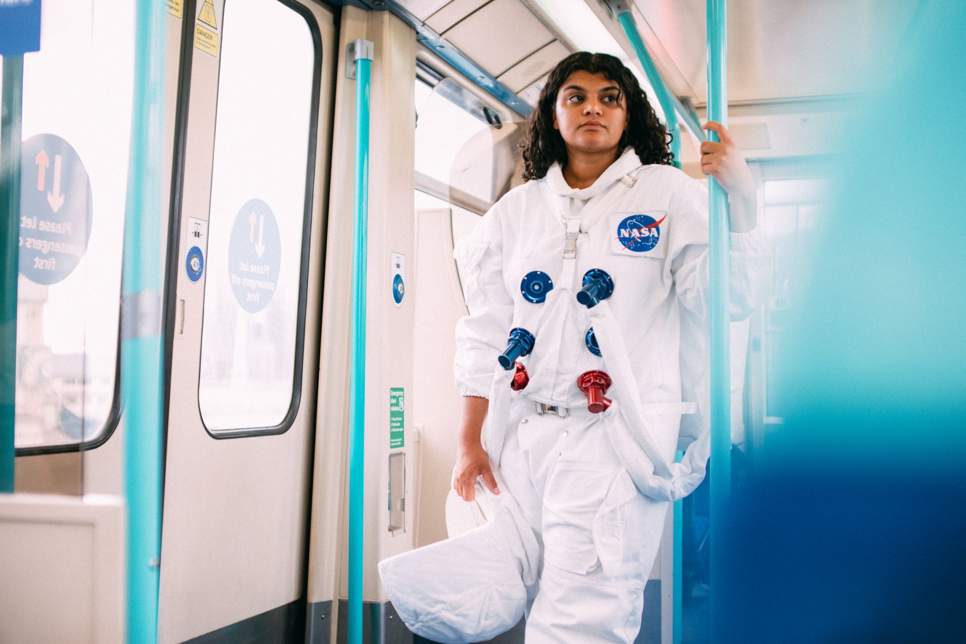 Astronauts in training suits inside a space agency facility