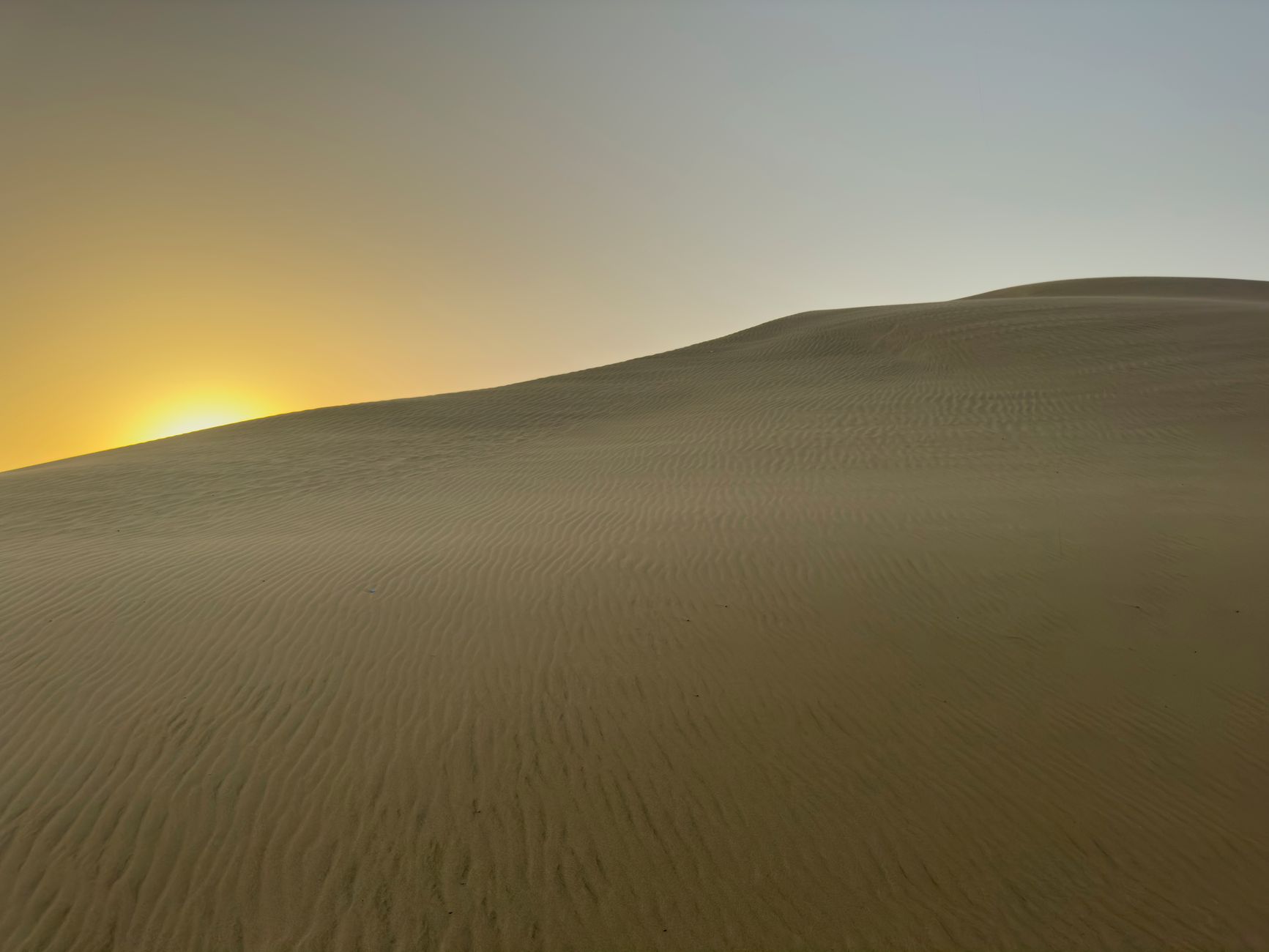 Wide cinematic desert landscape with dramatic sky, recalling the visual world of Dune