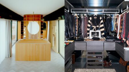 Organized walk-in closet with dark wood shelving and neatly arranged clothing