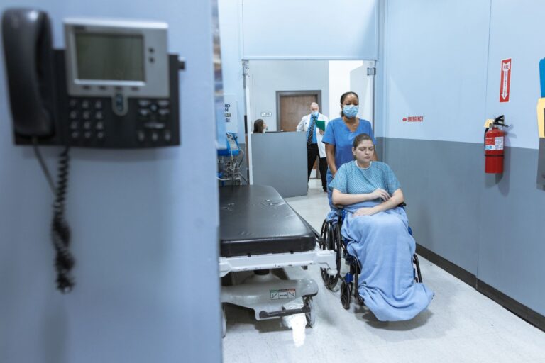 Pennsylvania Measles Outbreak Claims Sixth Life as Death Toll Mounts Empty hospital corridor with overhead lighting, representing medical emergency response