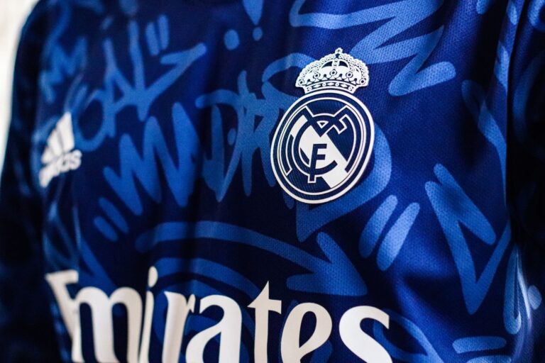 Close-up of a colorful football kit laid flat on a surface