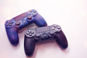 A modern gaming console controller resting on a dark surface