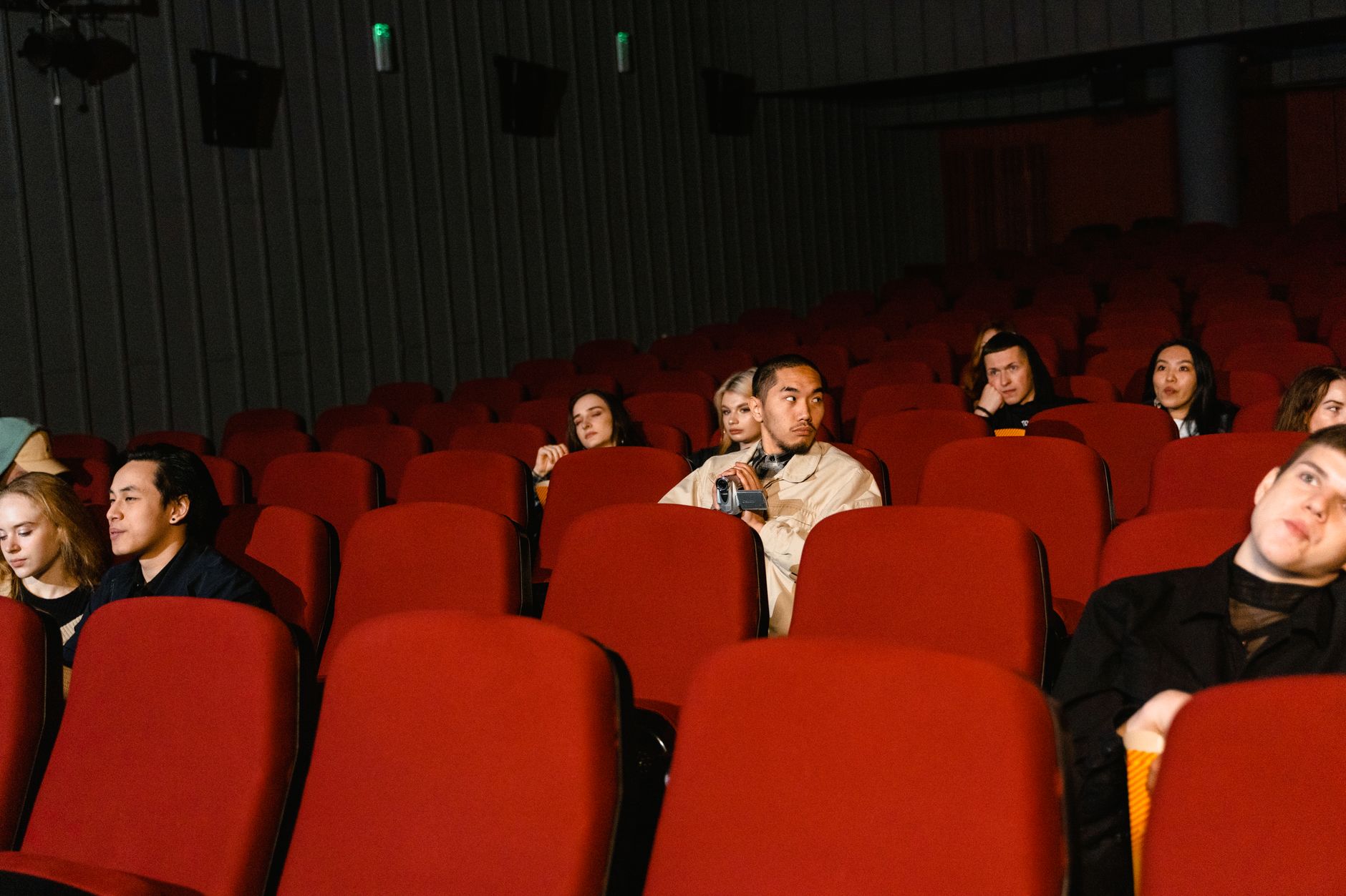 Audience seated at an indoor film festival screening