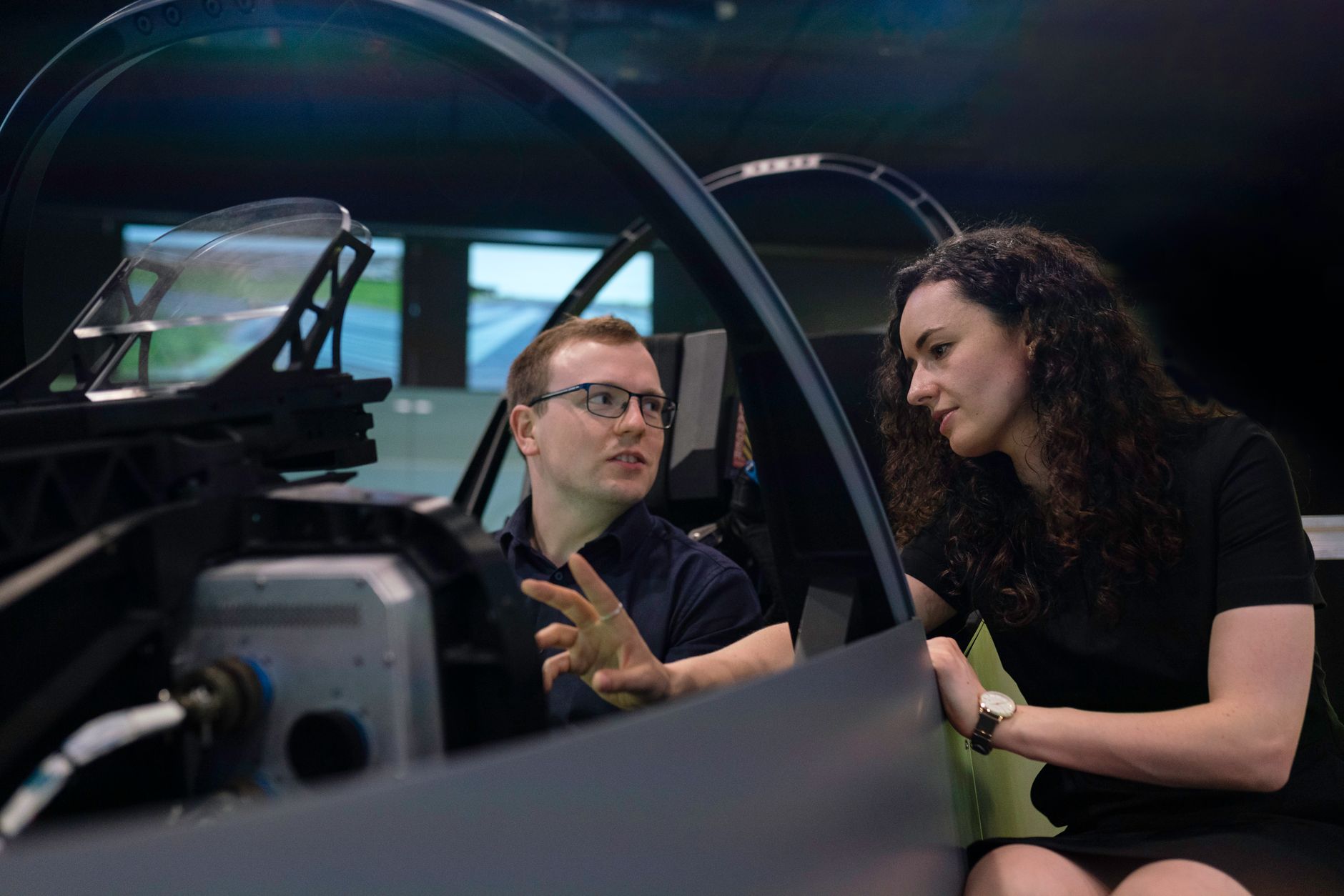 Engineers reviewing technical documents in an aerospace facility