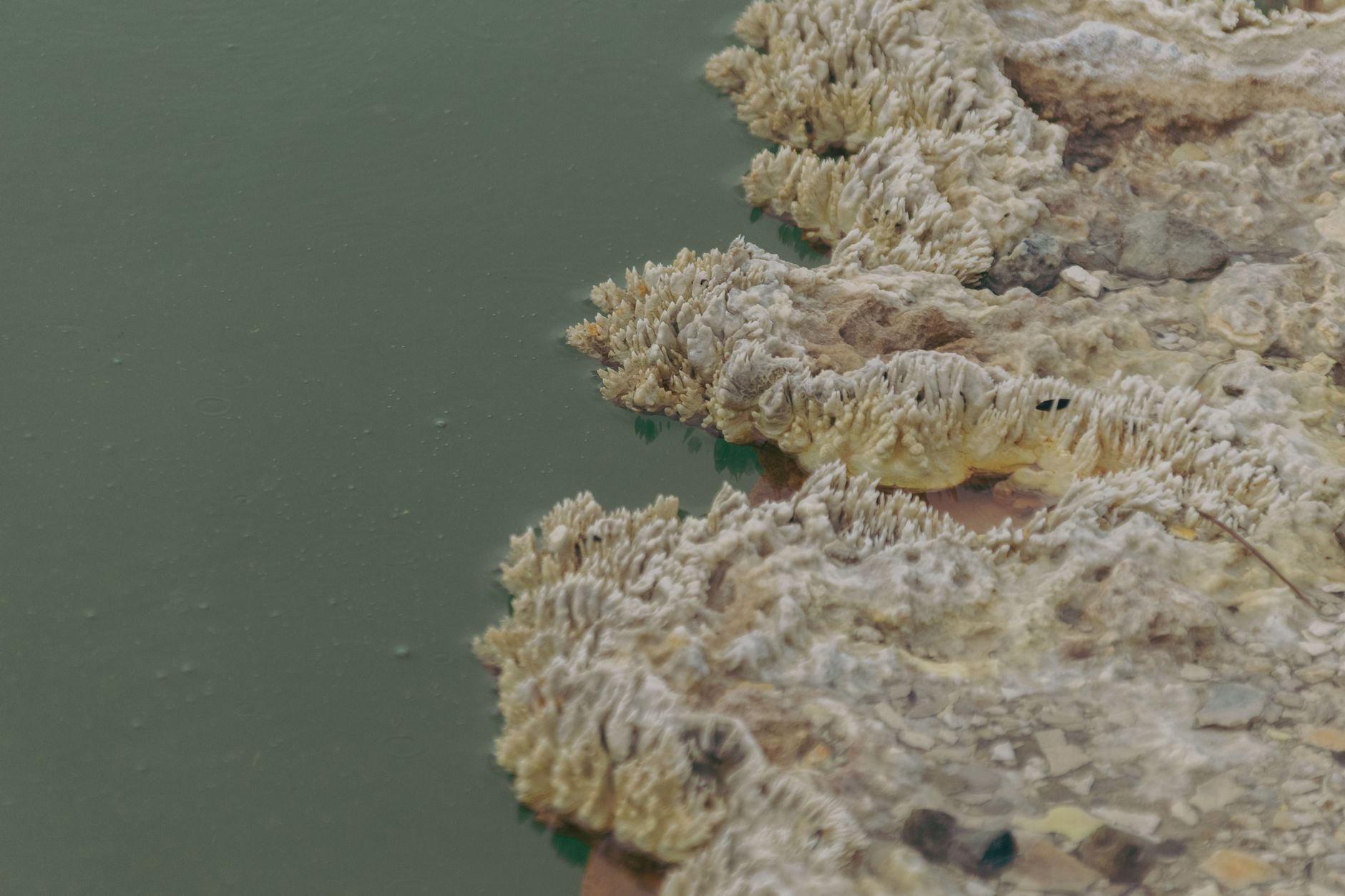 Deep ocean hydrothermal vent releasing hot mineral-rich water into cold dark water