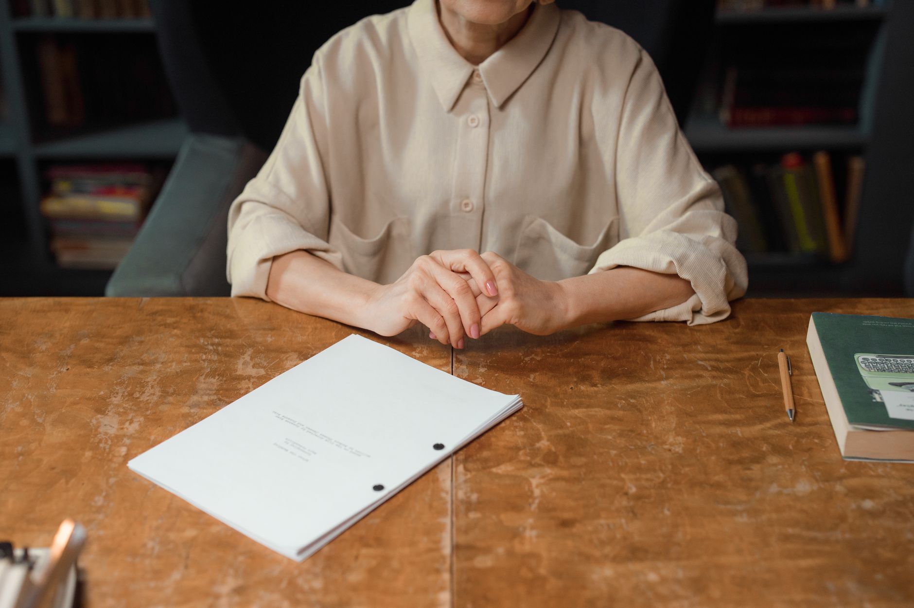 A writer's desk with script pages scattered, representing the craft of screenwriting
