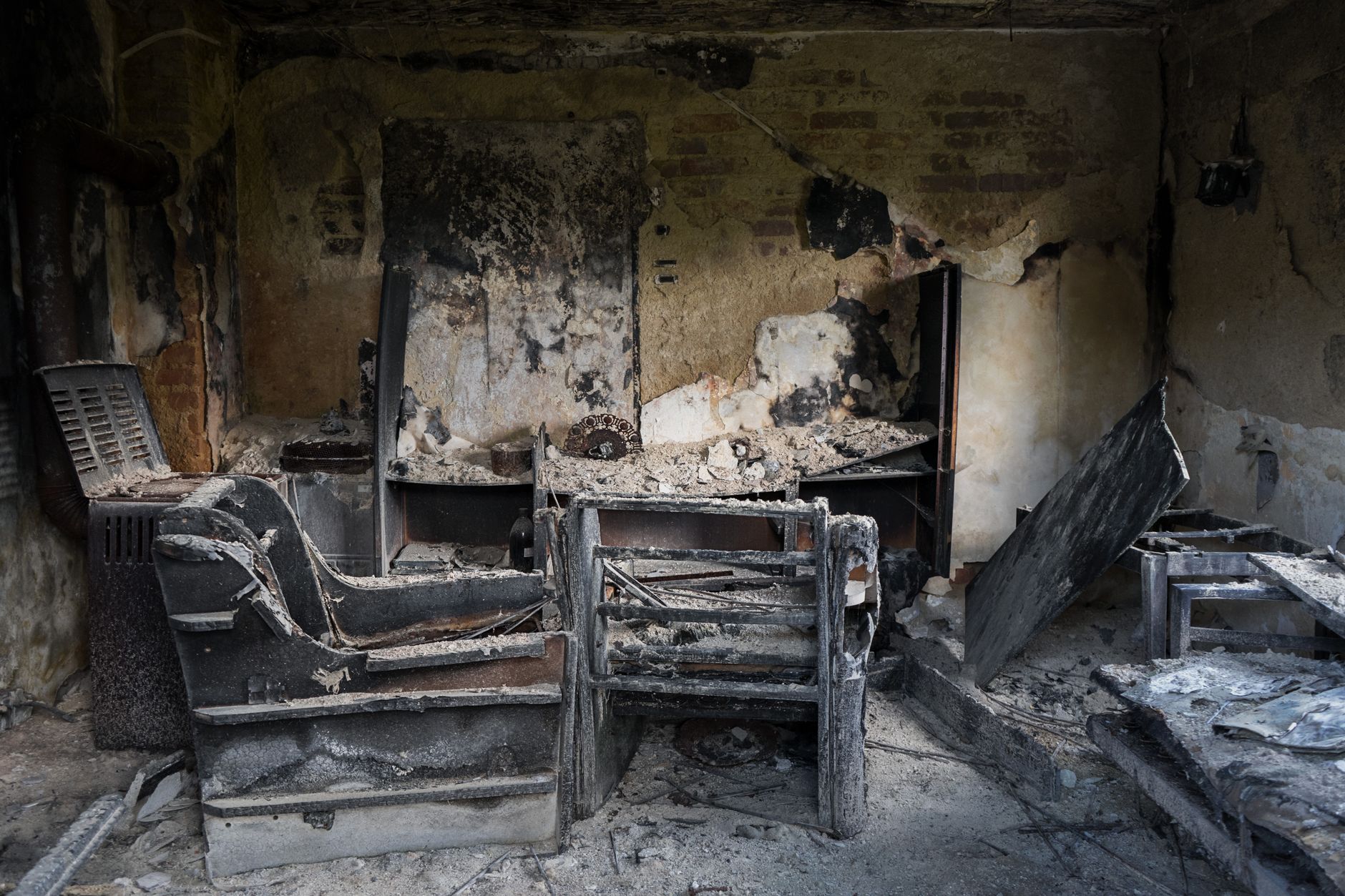 Smoke and fire damage visible inside a commercial storage area