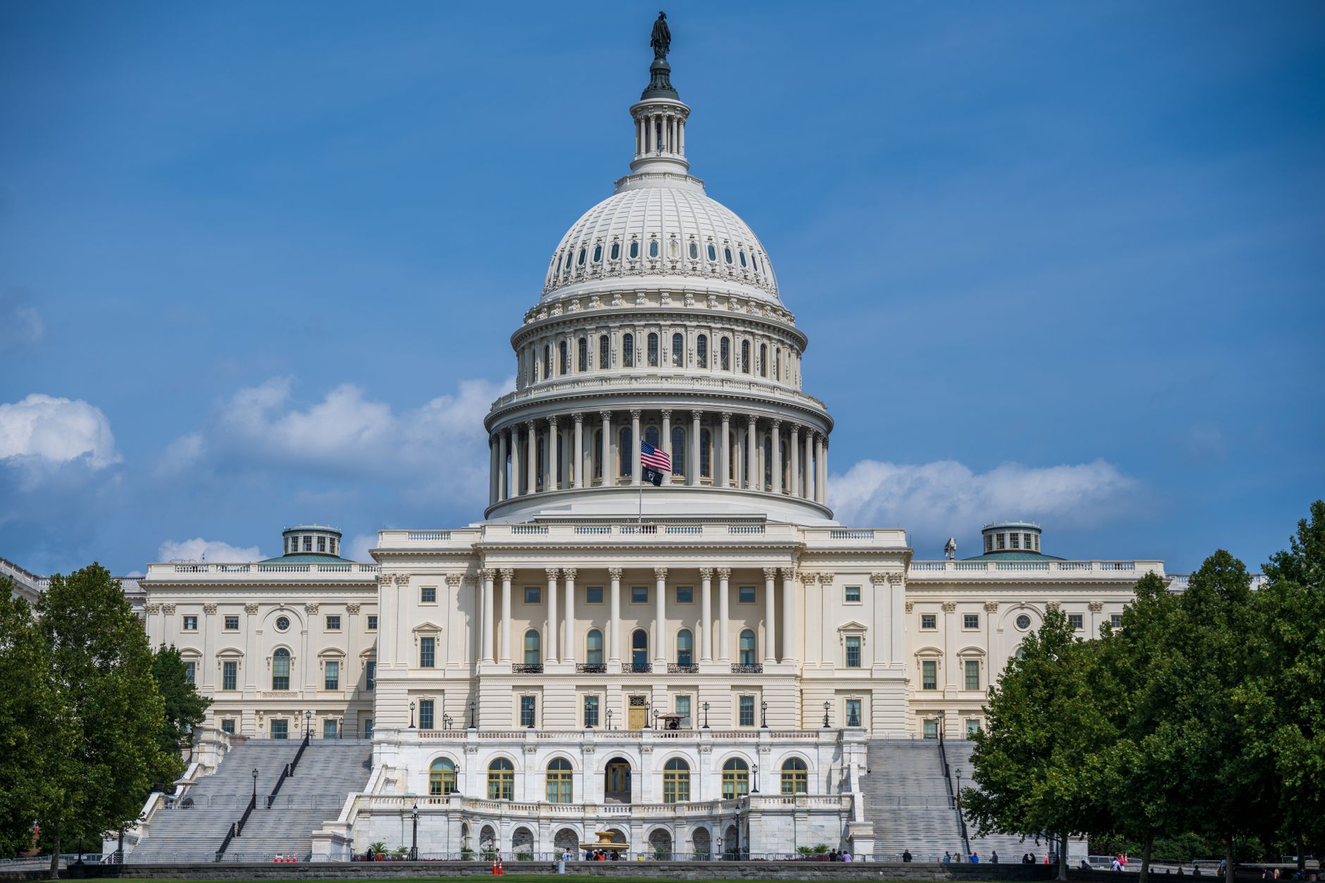 The United States Capitol building under a partly cloudy sky