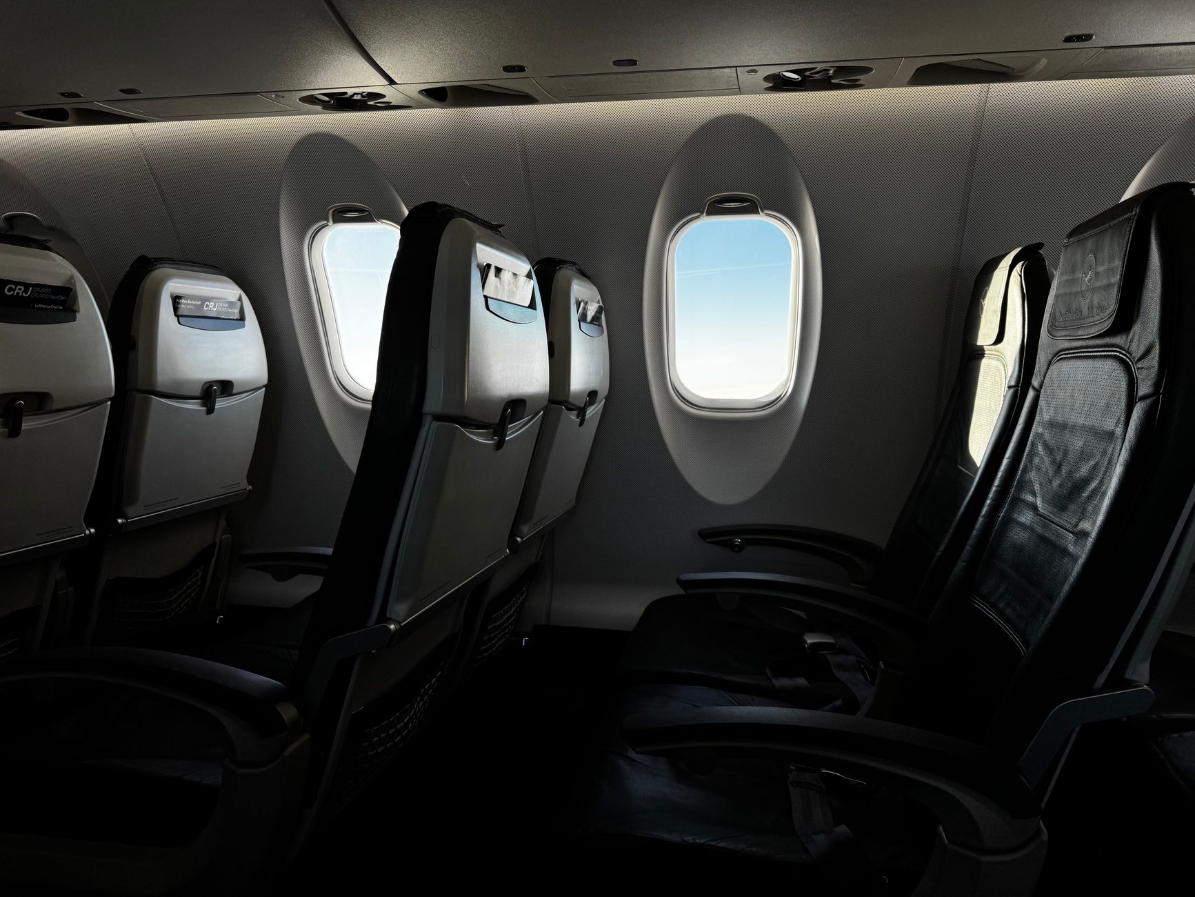 View from an airplane window during a long-haul flight at dusk
